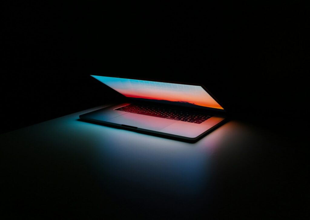 Laptop on a dark desk, an illustrative photograph for AI agent website access