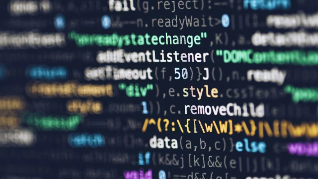 Close-up of programming code displayed on a computer monitor