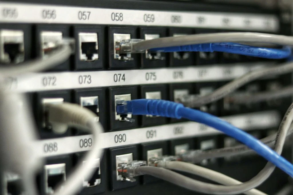 Network cables connected to equipment, illustrating connections between software systems.