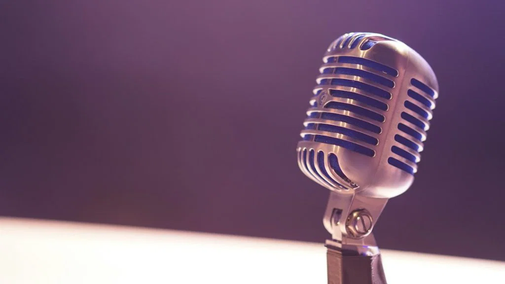Microphone on a stand, representative photograph for voice-agent infrastructure.